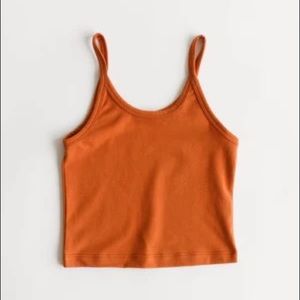 Arq cropped tank in rust, size medium